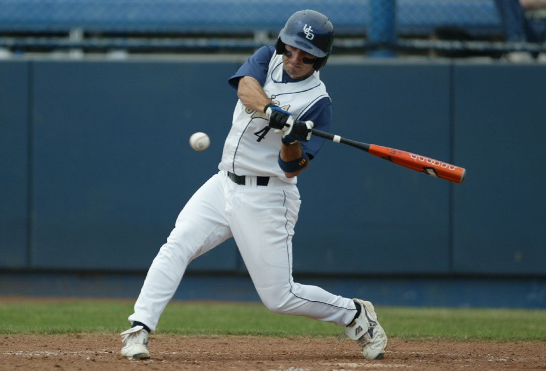 Daniel Descalo in the process of swinging at a pitch