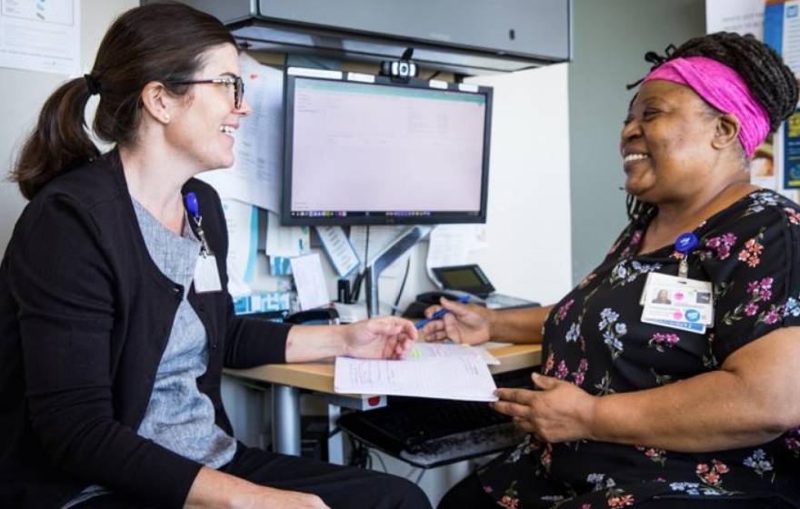 Two nurses in conversation