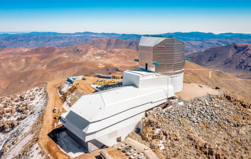 A large astronomical observatory on a bare, rocky mountain peak